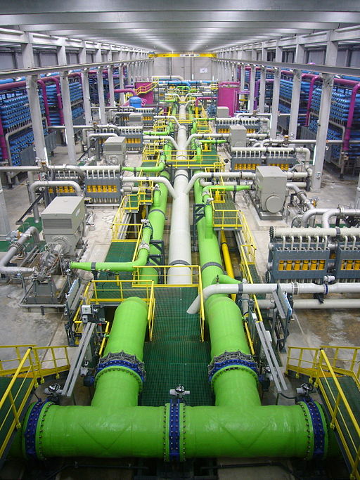 The inside of a reverse osmosis desalination plant. Photo by James Grellier via wikimedia commons