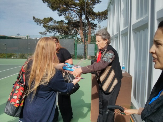 Grandin signing one of her books after giving a presentation on the strengths of the autistic mind.