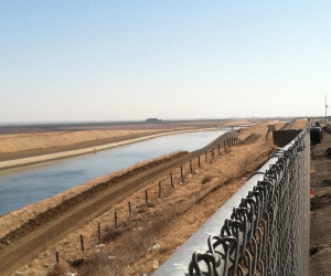 Water in the California Aqueduct flowing south. According to Aquafornia, "70 percent of California’s runoff occurs north of Sacramento, 75 percent of California’s urban and agricultural demands are to the south."